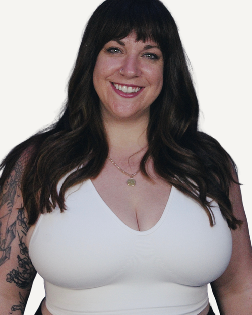 Woman wearing a white bra for everyday wear and yoga. 
